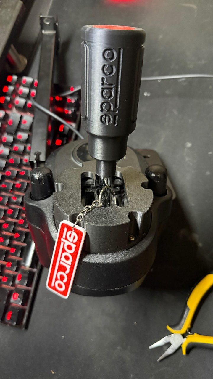 Sparco-style gear knob and custom 3D-printed adapter fitted to a Logitech shifter, with a matching keychain