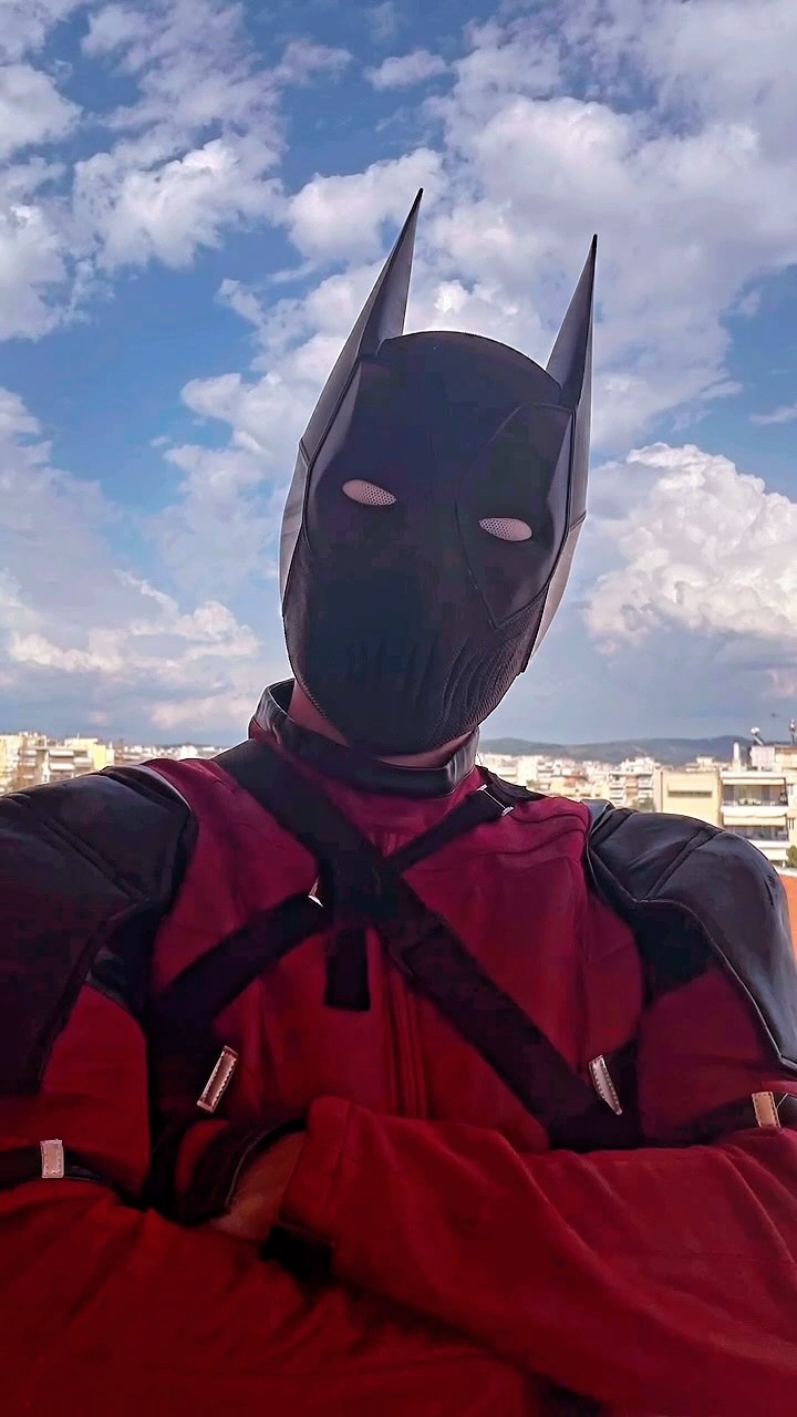 Black BatPool cosplay mask with pointed ears and textured print details